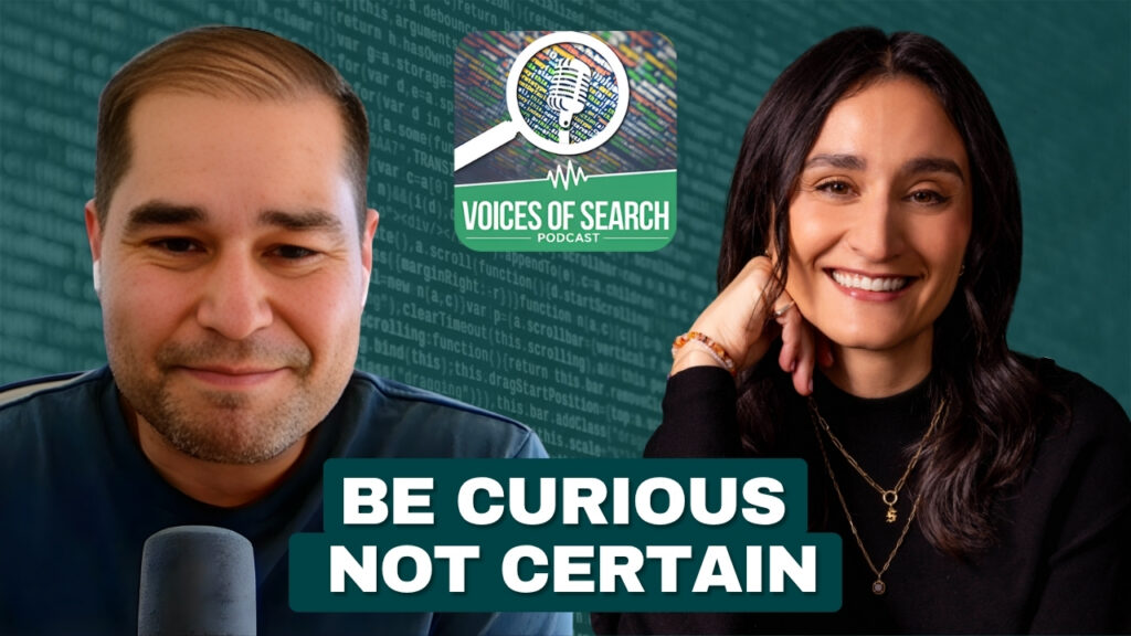 Two people smiling with “Voices of Search Podcast” logo and the text “Be Curious Not Certain” in front.